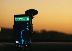smartphone displaying gps map on holder inside car 2996306